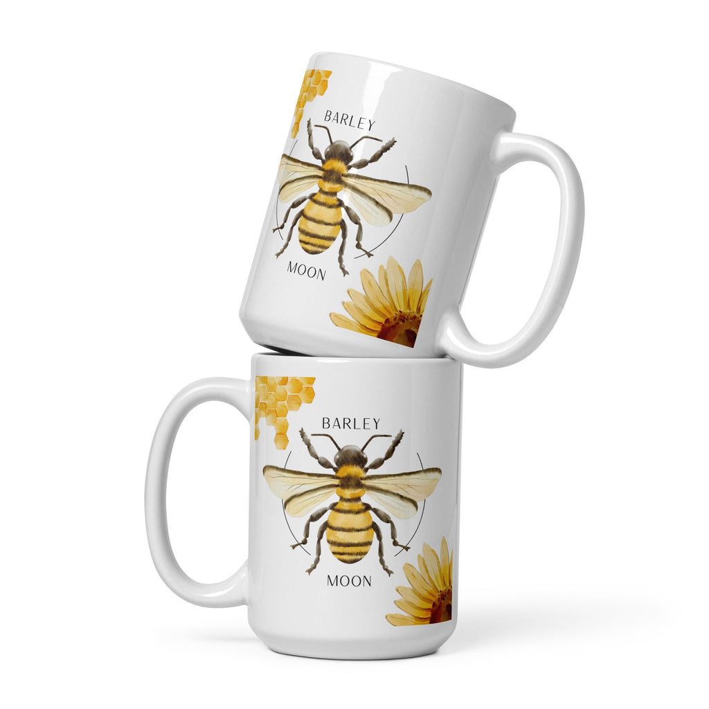 Barley Moon Botanicals 15 oz white ceramic mug featuring a bee, honeycomb, and flower illustration.