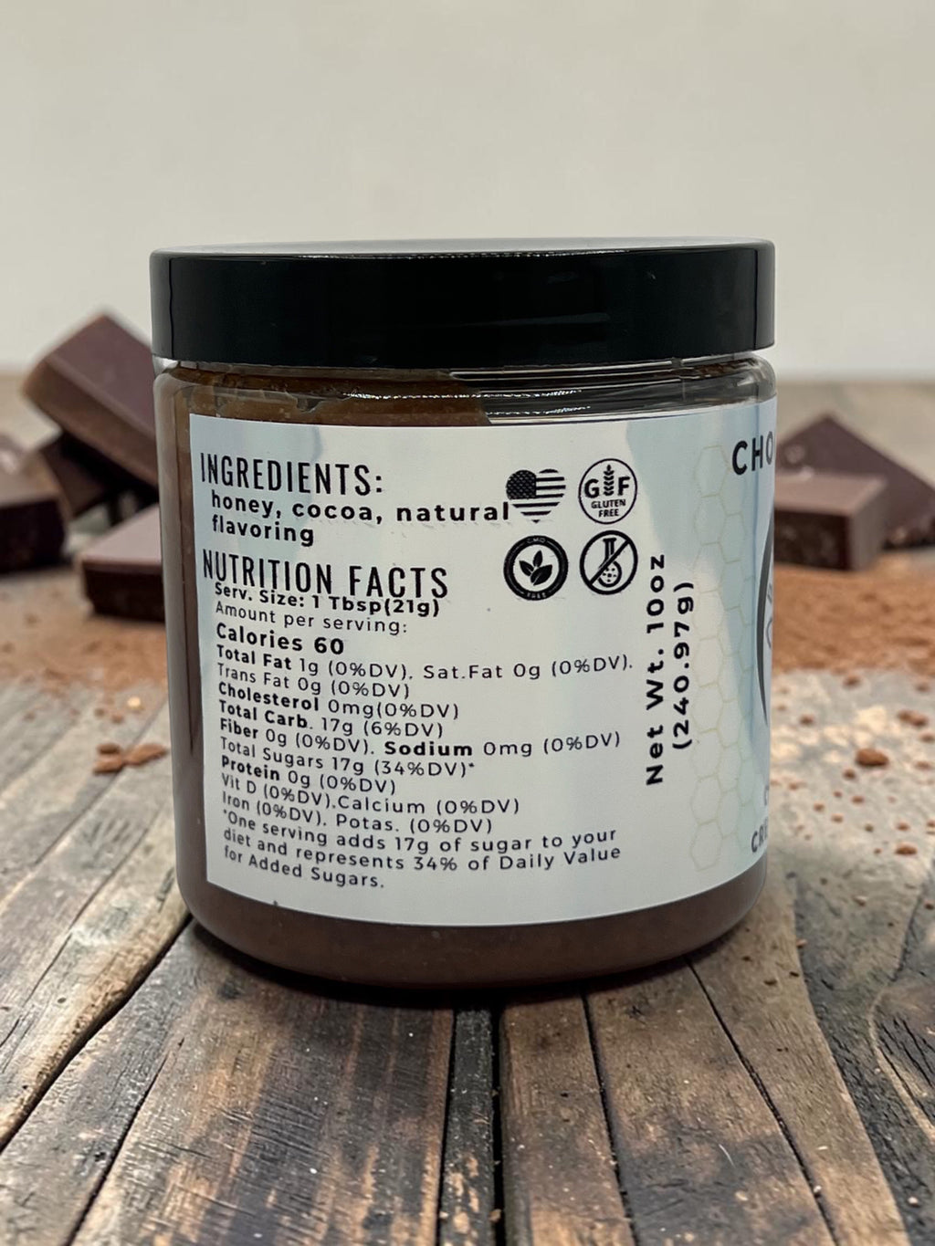 Barley Moon Botanicals Chocolicious chocolate creamed honey jar showing nutrition facts label and cocoa powder