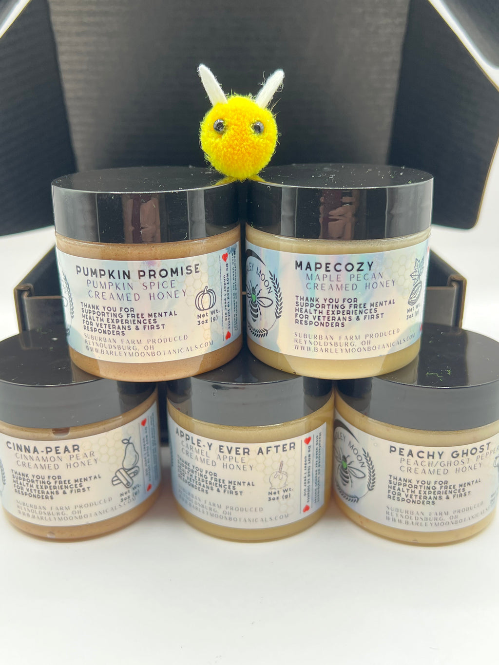 Barley Moon Botanicals Autumn Indulgence creamed honey flight featuring five seasonal flavors with a felt bee topper.