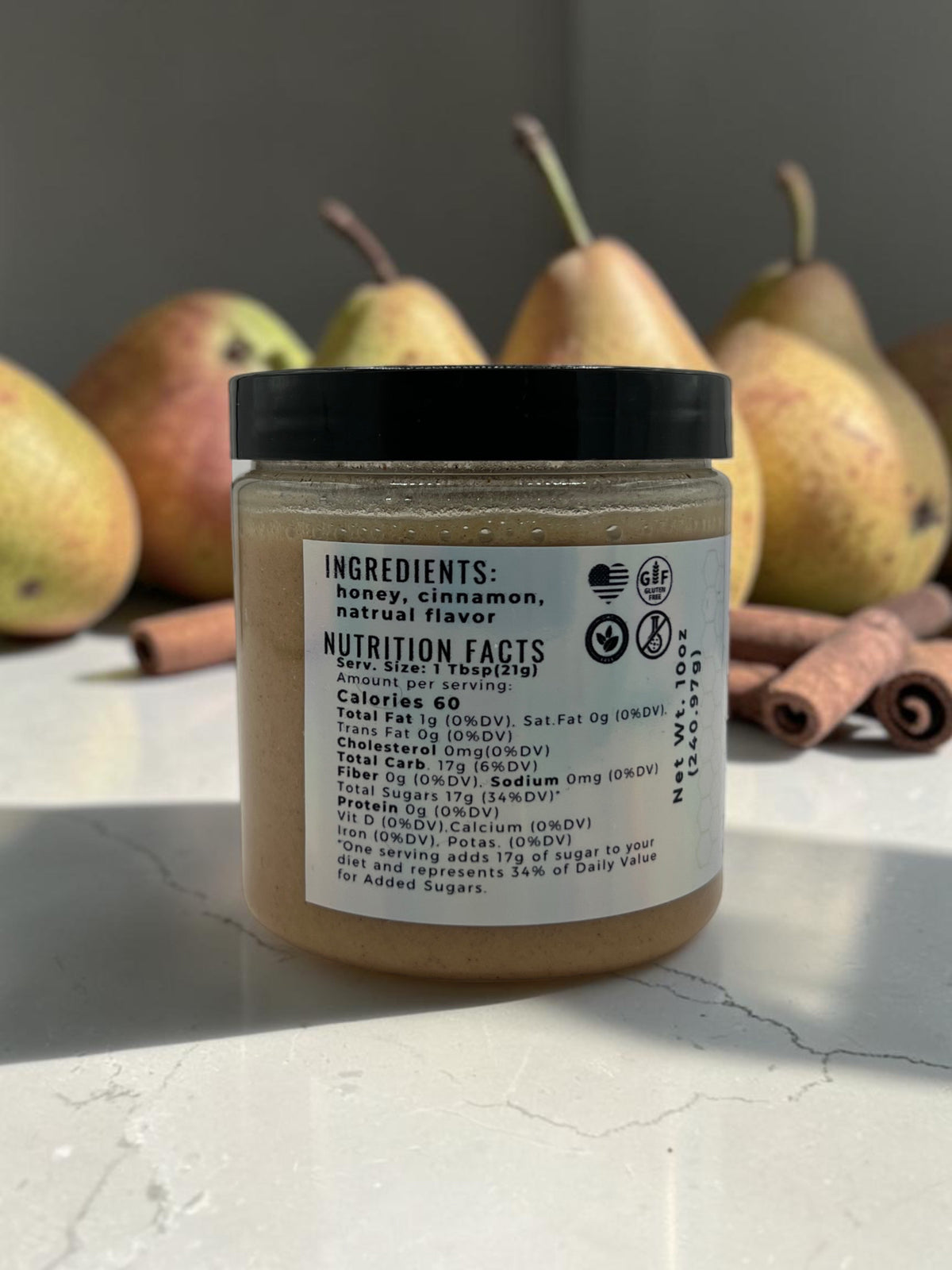 Barley Moon Botanicals Cinna-Pear creamed honey jar showing nutrition label with fresh pears and cinnamon sticks