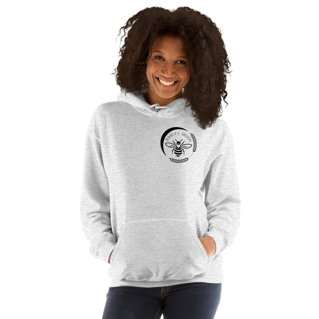 Barley Moon Botanicals grey unisex hoodie with a black bee and crescent moon logo on a smiling woman