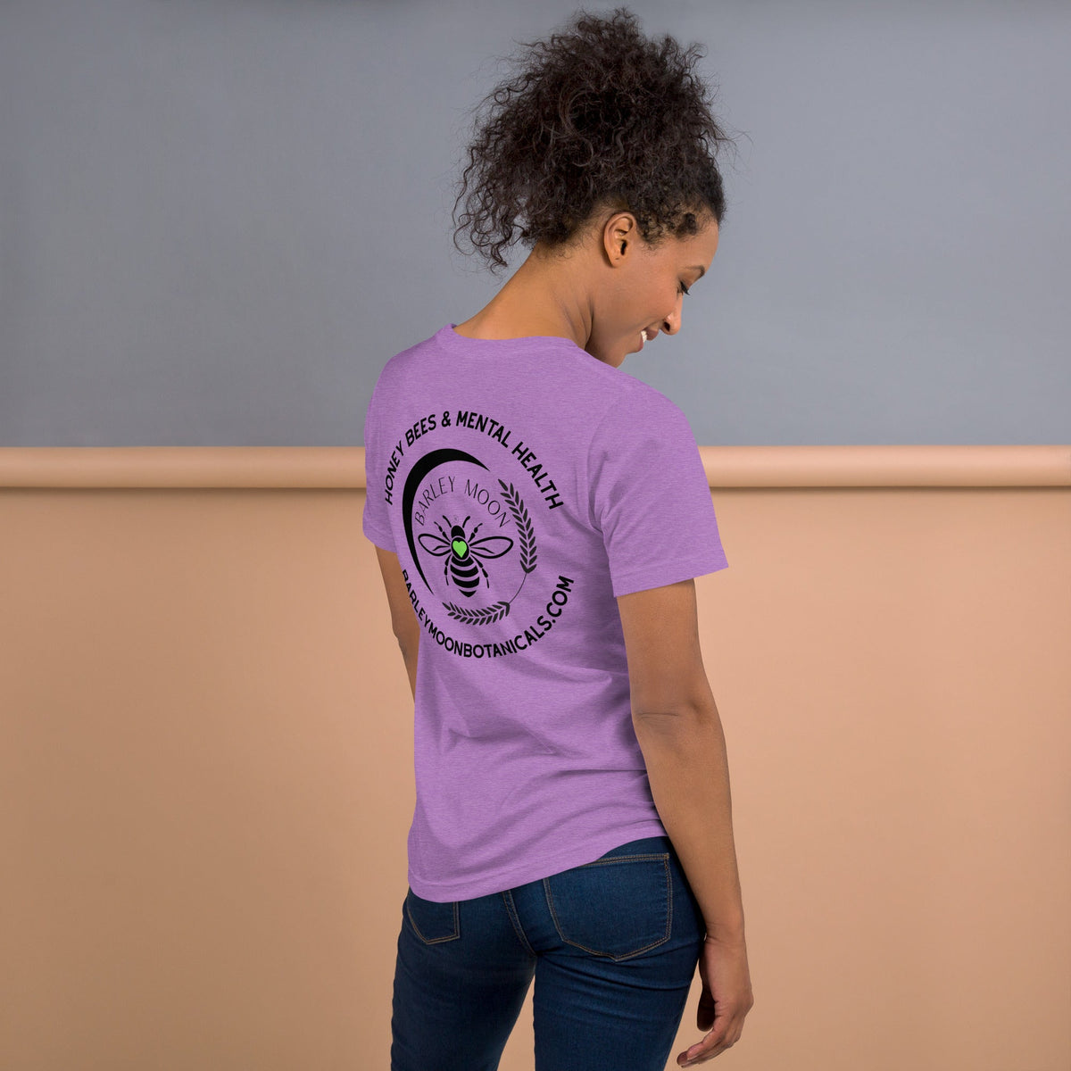 Barley Moon Botanicals lavender t-shirt with Honey Bees & Mental Health logo on the back worn by a woman