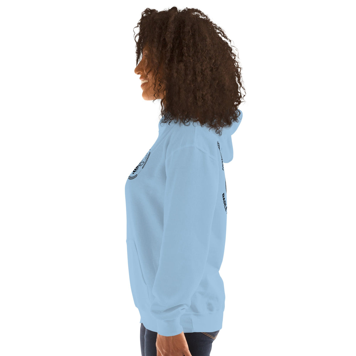 Barley Moon Botanicals light blue unisex hoodie with bee and moon logo, worn by a woman in profile view.