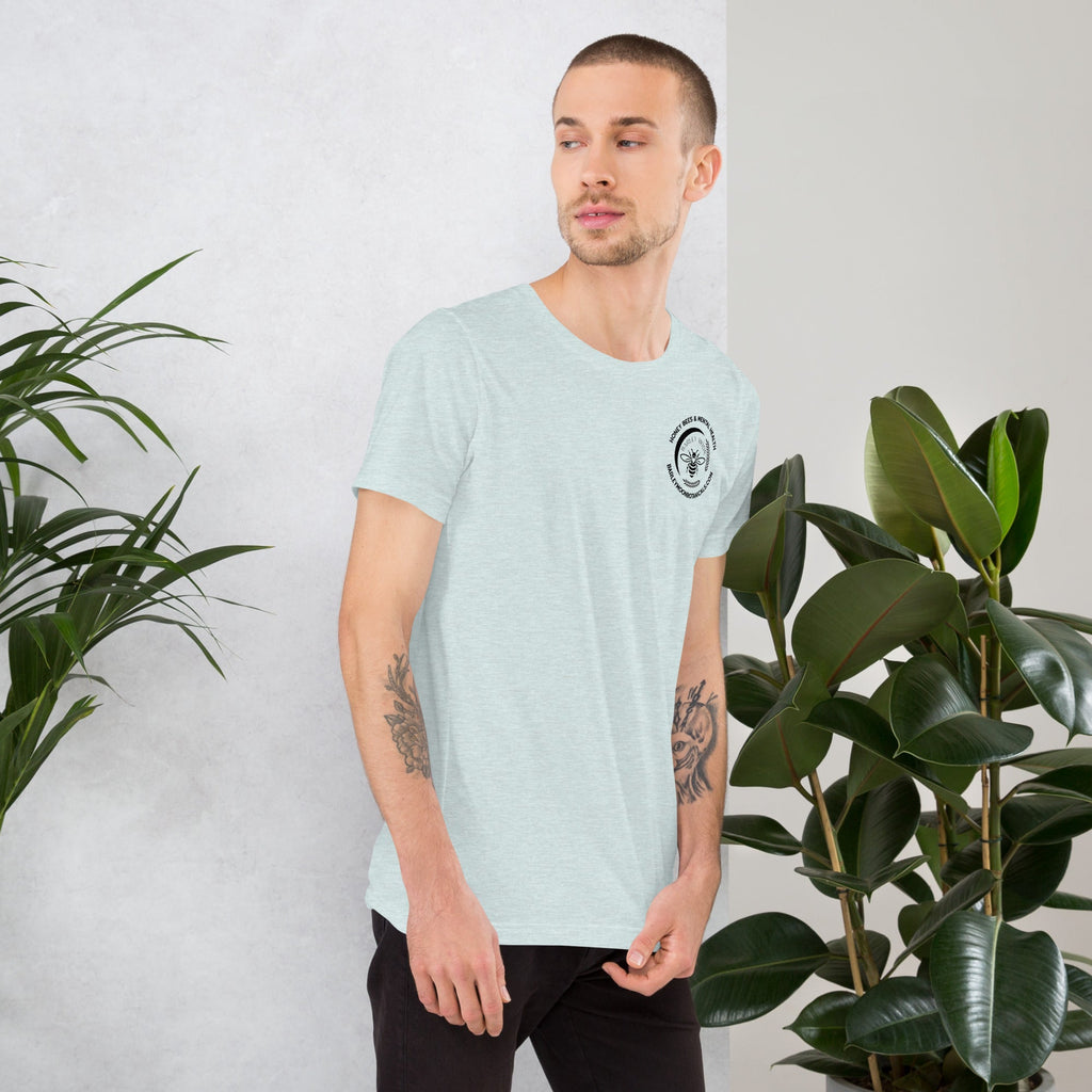 Barley Moon Botanicals unisex t-shirt in light heather blue with a small bee logo on the chest worn by a man