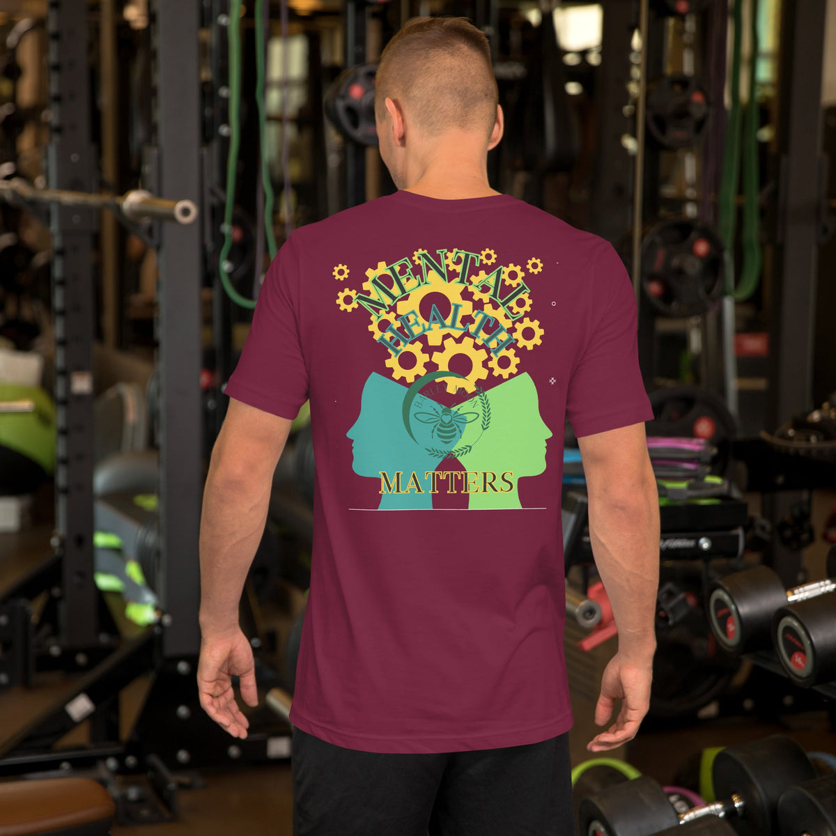Barley Moon Botanicals unisex maroon t-shirt with a mental health graphic on the back, worn by a man in a gym.