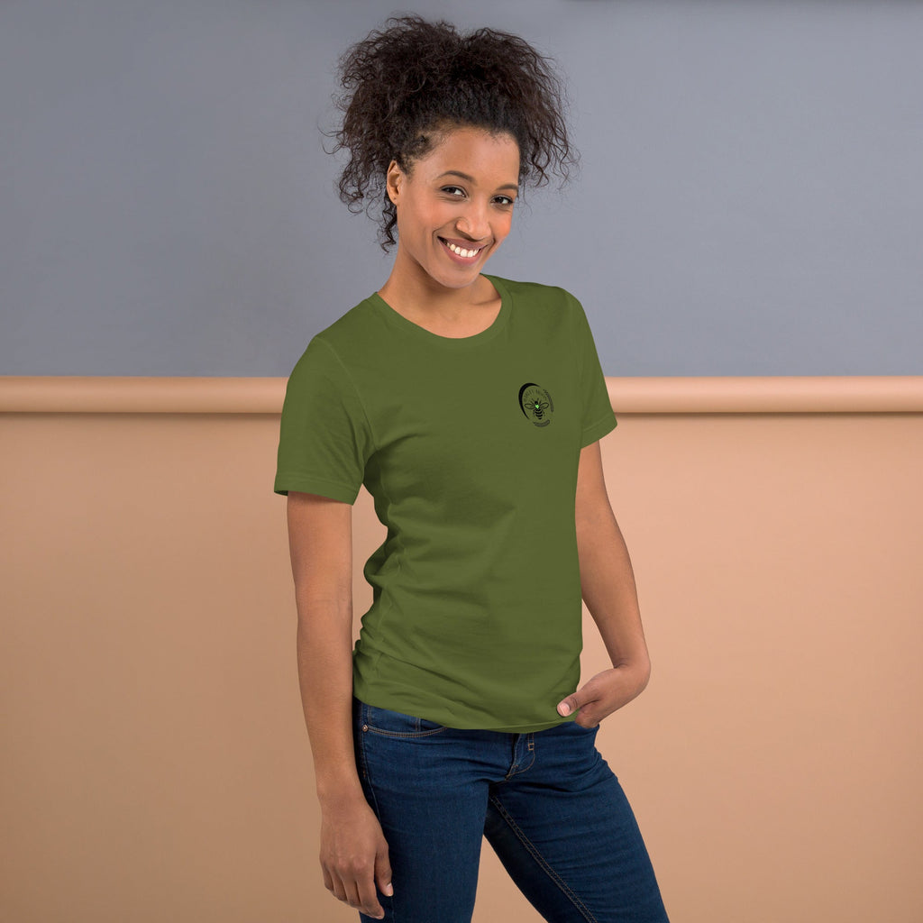 Woman wearing an olive green Barley Moon Botanicals cotton t-shirt with a small black bee and crescent moon logo.