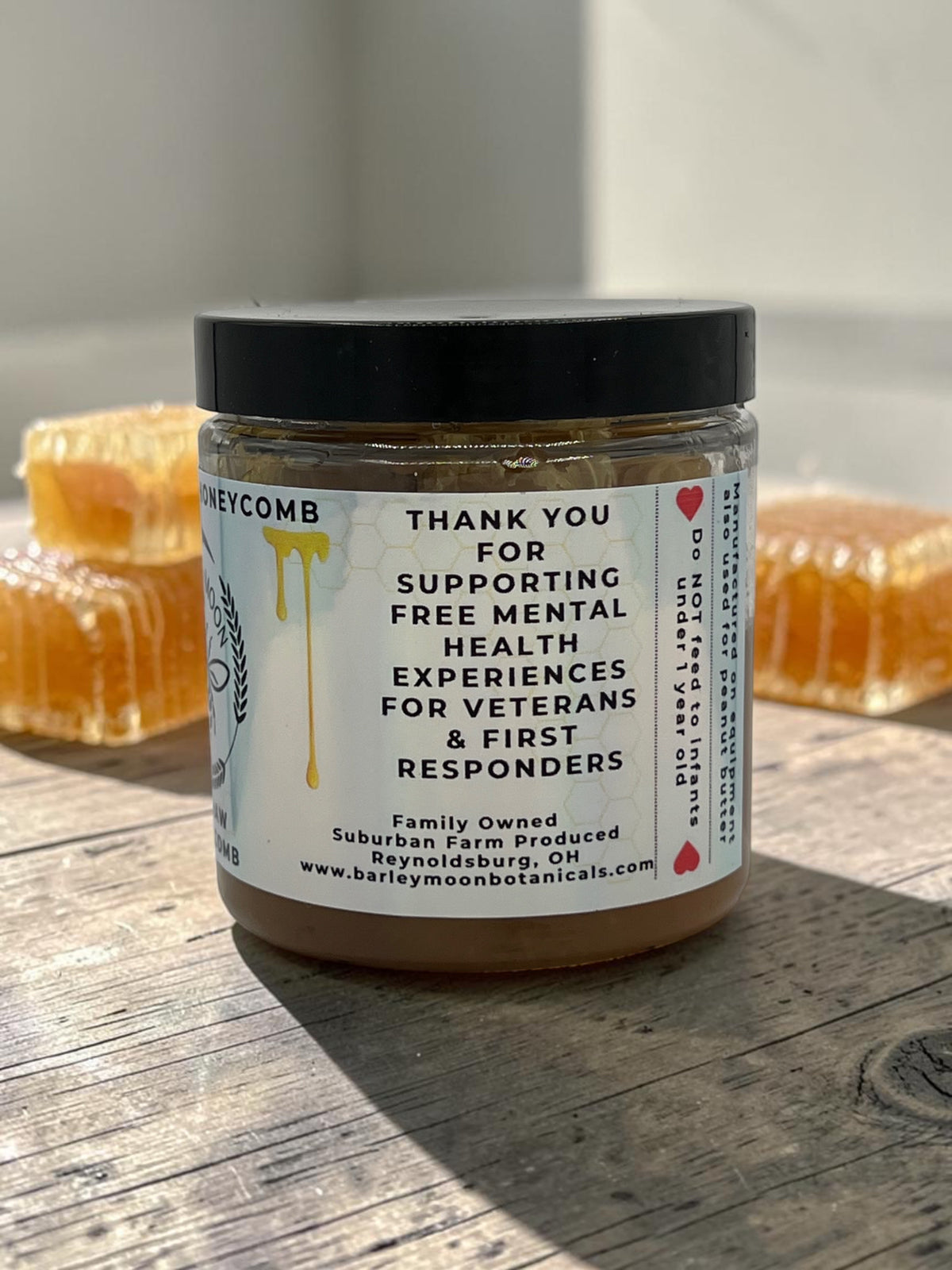 Barley Moon Botanicals raw honeycomb jar with label detailing support for veterans and first responders