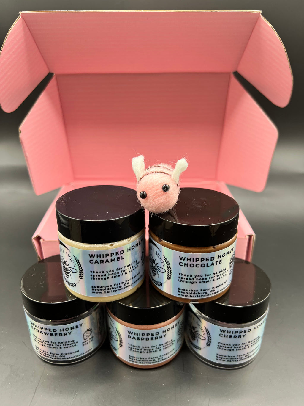 Barley Moon Botanicals Bee Mine whipped honey flight set with five jars, and a cute felt bee.